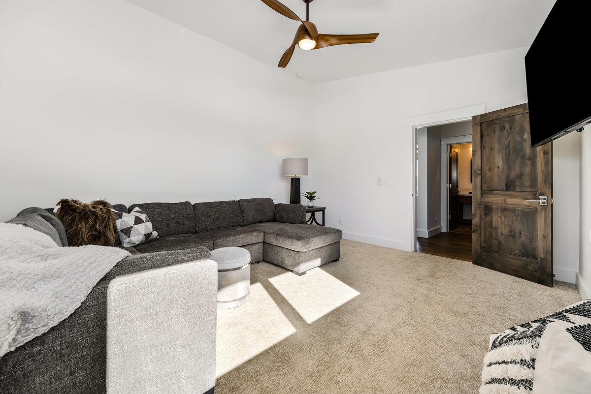 11654 Henness Road Truckee, CA 96161 - Photo 21 of 21 a living room with a couch and a flat screen tv