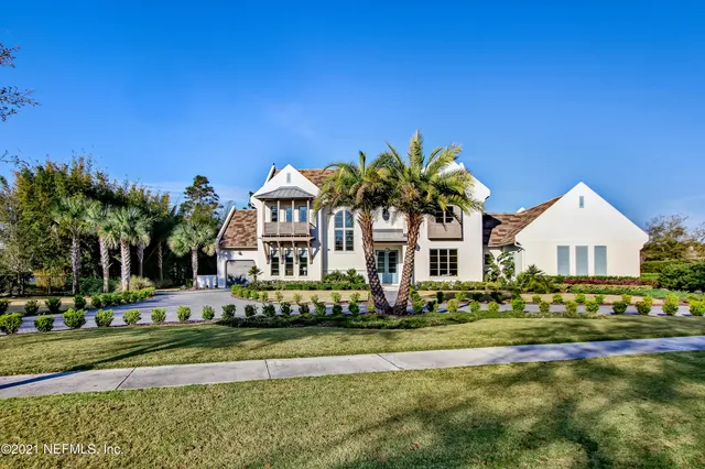 an aerial view of a house with outdoor space pool seating area and yard