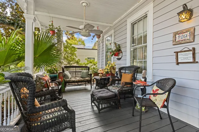 a living room with furniture chess board and a window
