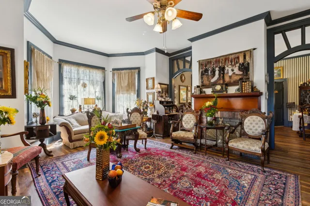 a view of a livingroom with furniture window and wooden floor
