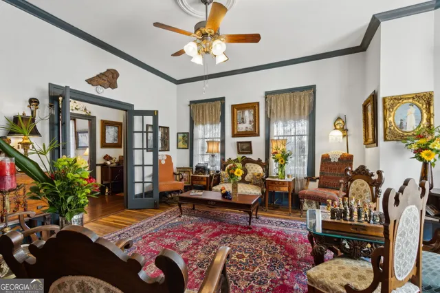 a view of a patio with chairs and potted plants