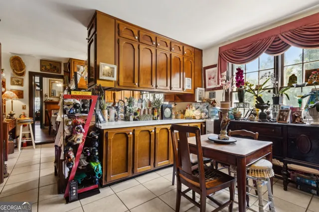 a kitchen with stainless steel appliances granite countertop a stove and cabinets