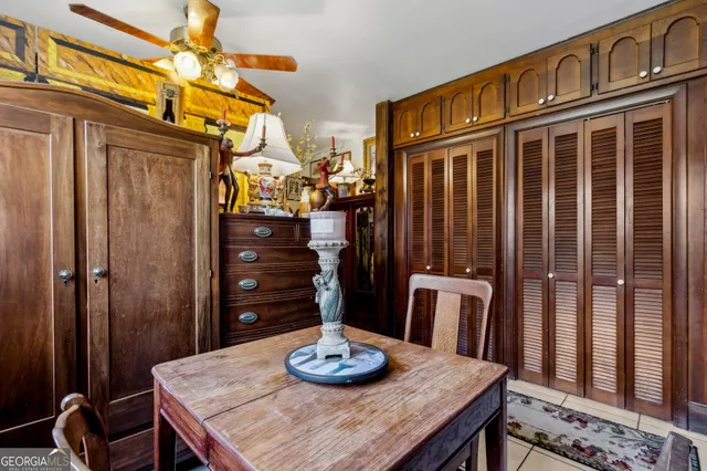 a bathroom with a toilet a sink and a mirror