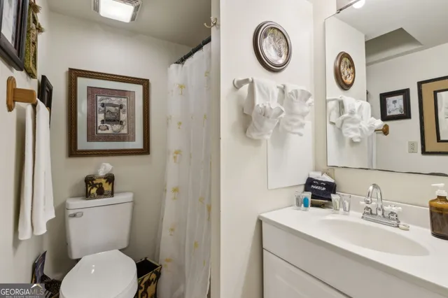 a view of a chairs and tables in the backyard of a house