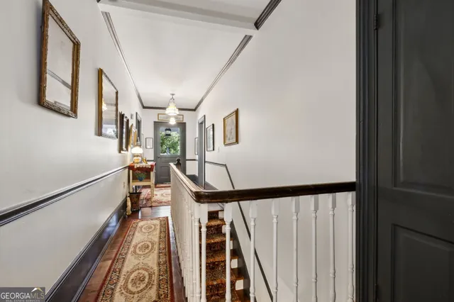 a group of people sitting on a floor in front of a building