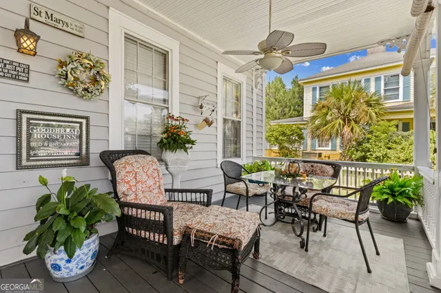 a view of a chairs and table in a patio