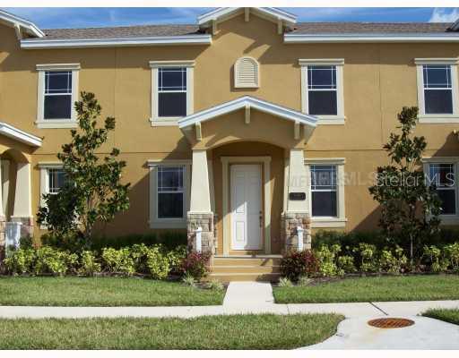 1581 Reflection Cove St. Cloud, FL 34771 - Photo 1 of 1 a front view of a house with garden