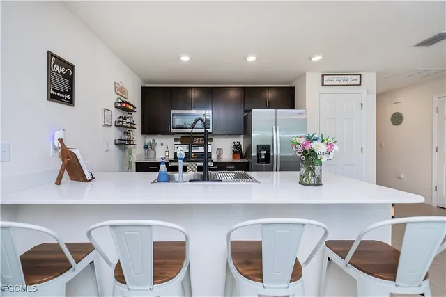 a dining room with furniture and a flat screen tv