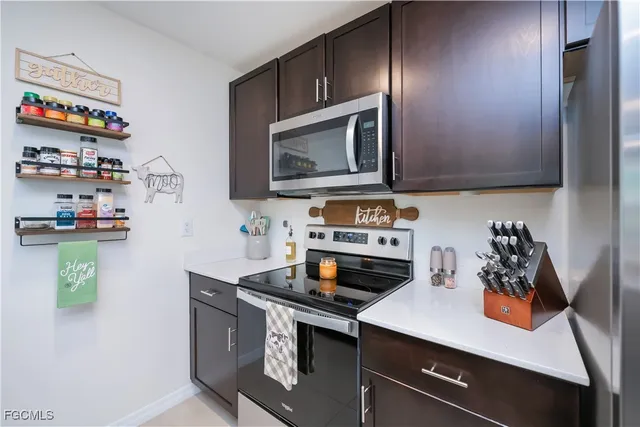 a kitchen with a stove and a microwave