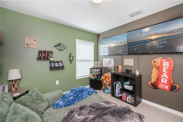 a bedroom with furniture and a window