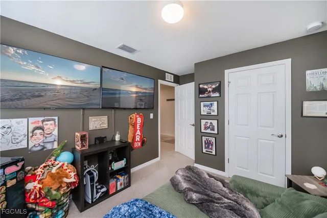 a bedroom with furniture and a bed