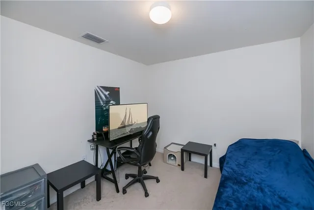 a workspace with furniture and a desk