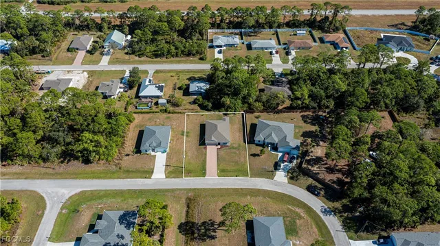 an aerial view of a house with a swimming pool