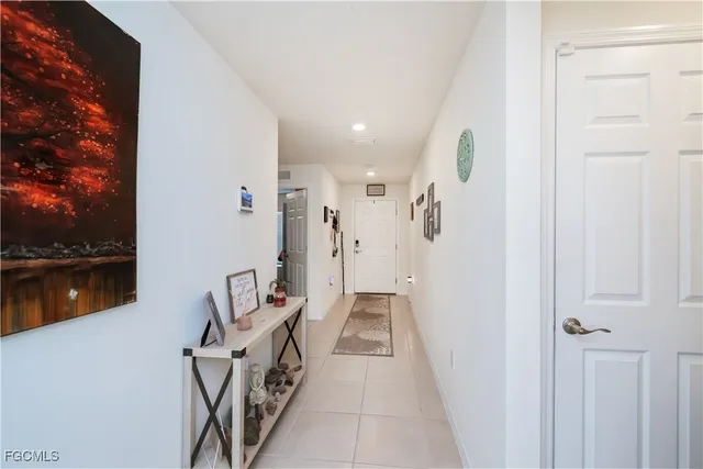a view of a hallway with seating area