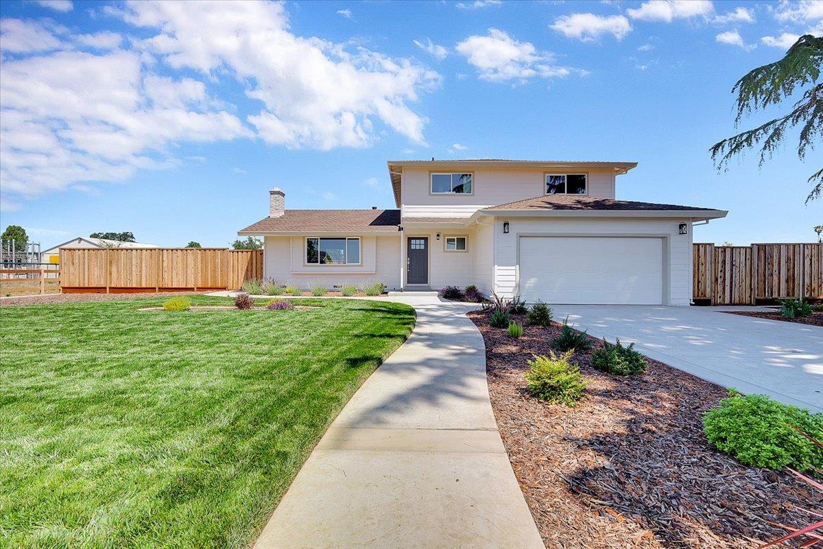 1181 Barry Road Yuba City, CA 95991 - Photo 1 of 60 a front view of a house with garden
