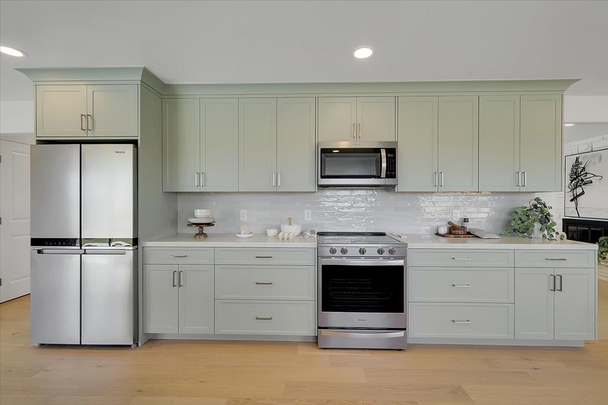 1181 Barry Road Yuba City, CA 95991 - Photo 19 of 60 a kitchen with stainless steel appliances white cabinets and a refrigerator