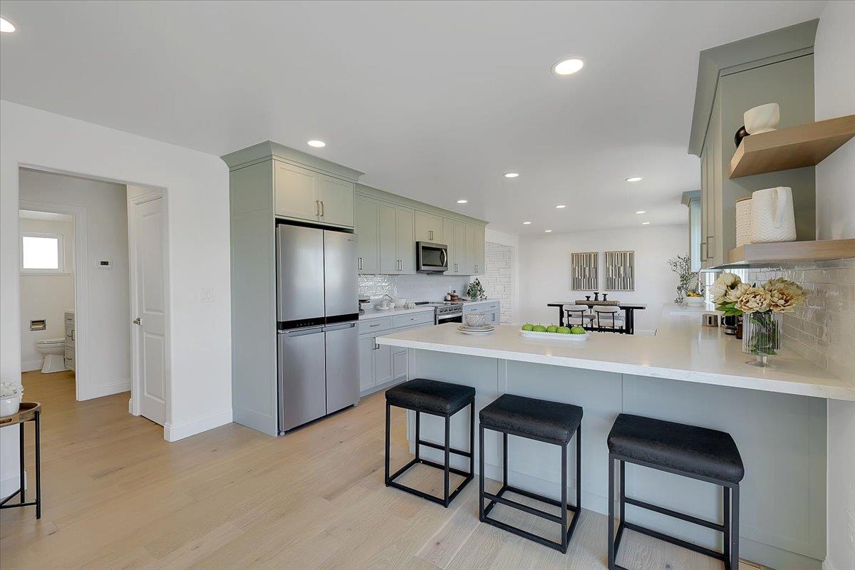 1181 Barry Road Yuba City, CA 95991 - Photo 23 of 60 a kitchen with a sink cabinets and stainless steel appliances