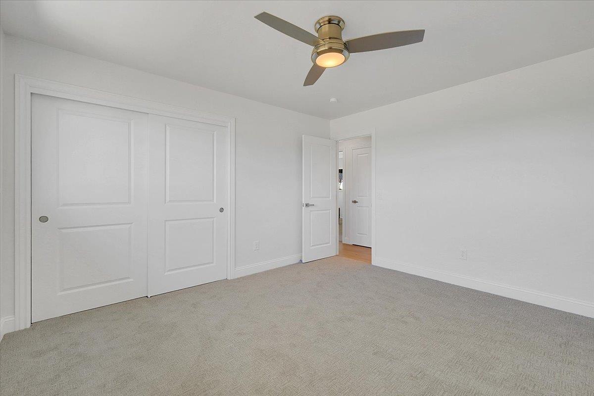 1181 Barry Road Yuba City, CA 95991 - Photo 33 of 60 an empty room with a ceiling fan and closet area