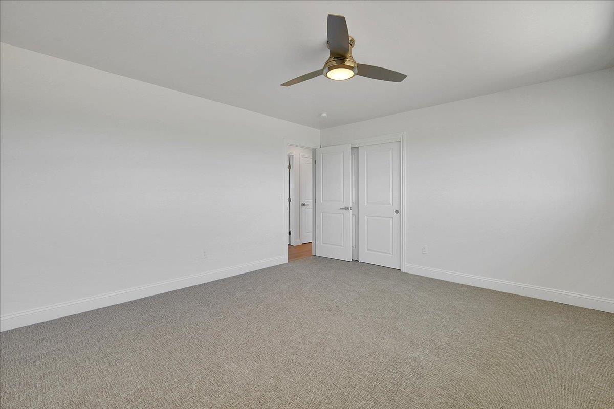1181 Barry Road Yuba City, CA 95991 - Photo 35 of 60 a view of an empty room with a chandelier fan