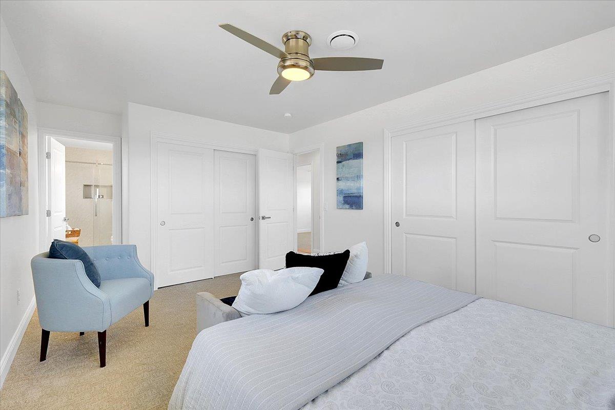 1181 Barry Road Yuba City, CA 95991 - Photo 37 of 60 a bedroom with a bed couch and a chandelier
