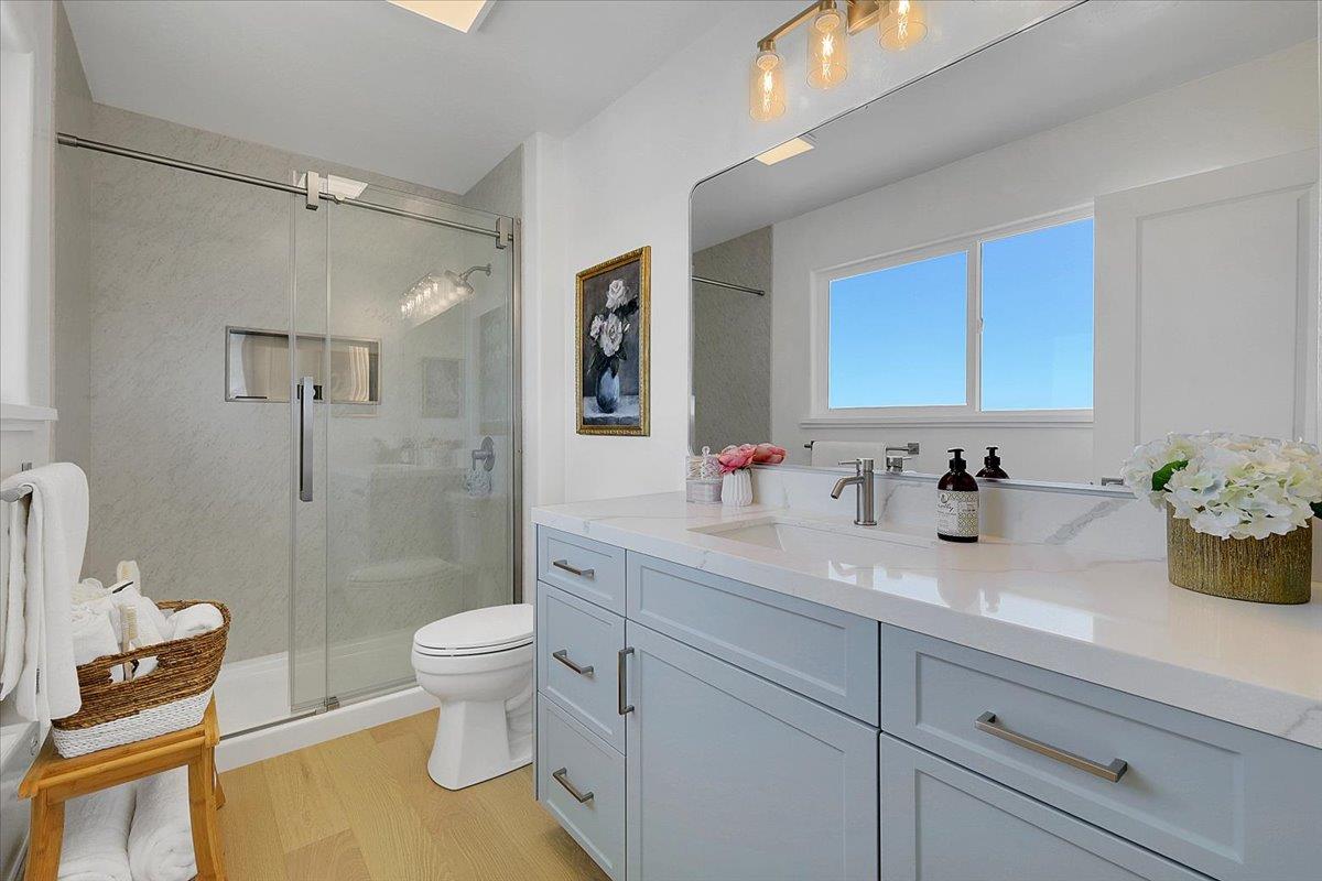 1181 Barry Road Yuba City, CA 95991 - Photo 38 of 60 a bathroom with a granite countertop sink a toilet and a mirror