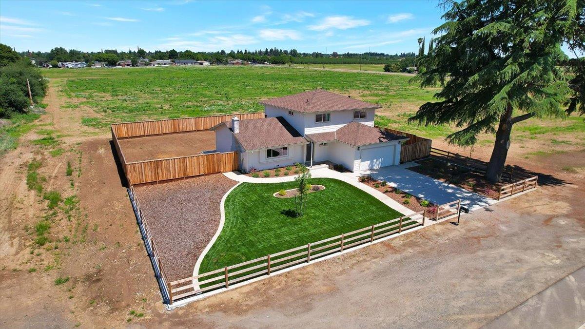 1181 Barry Road Yuba City, CA 95991 - Photo 48 of 60 an aerial view of a house with a garden and lake view