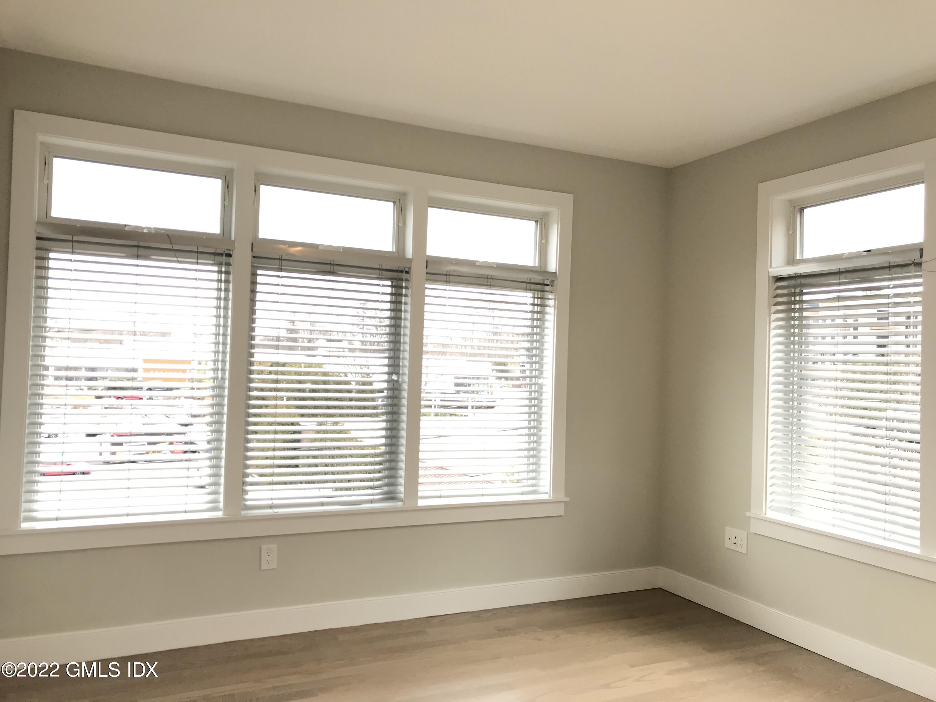 56 Old Field Point Road, Unit 1 Greenwich, CT 06830 - Photo 20 of 30 a view of an empty room with a window