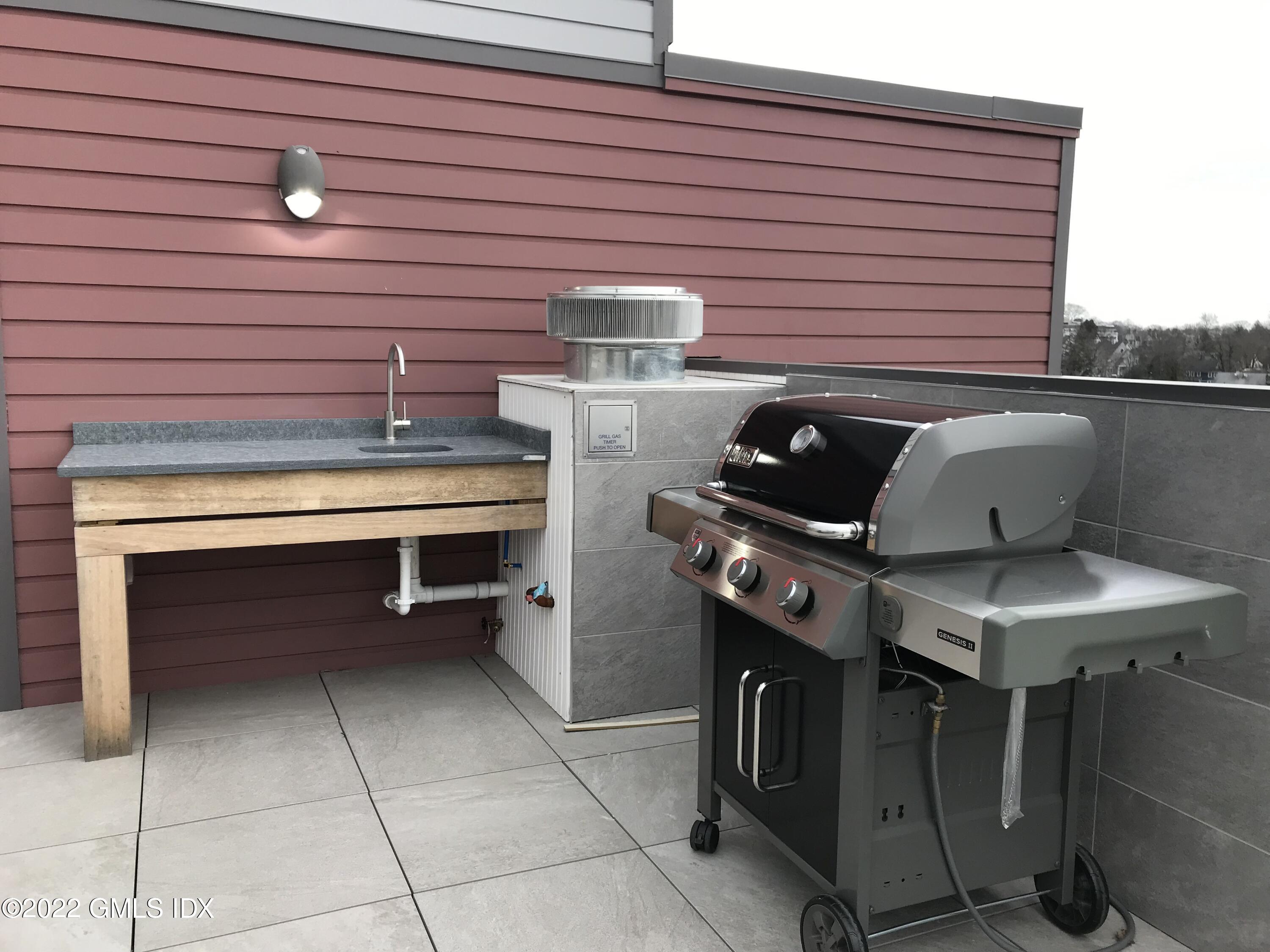 56 Old Field Point Road, Unit 1 Greenwich, CT 06830 - Photo 28 of 30 a roof top oven sitting inside of a kitchen