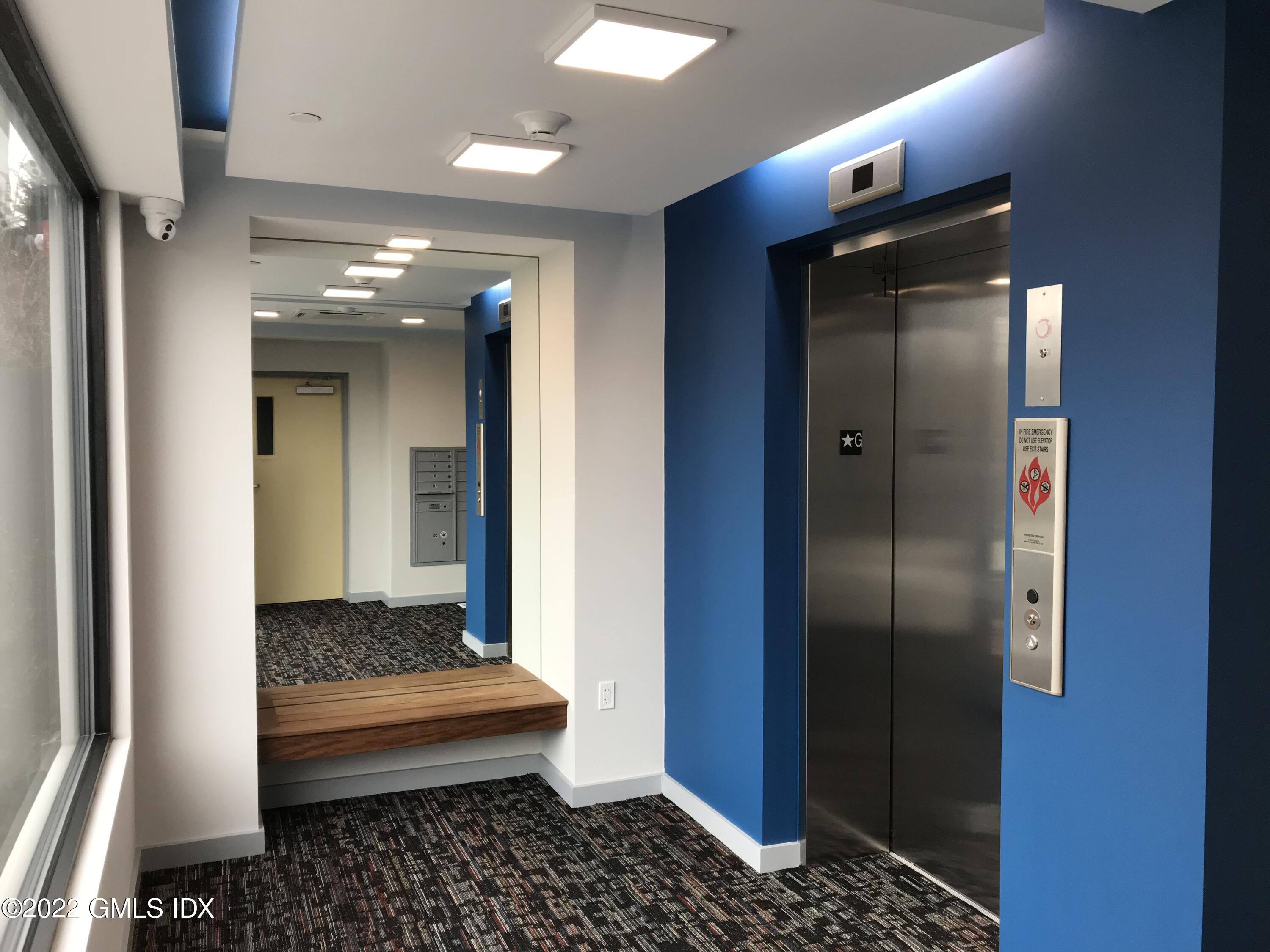 56 Old Field Point Road, Unit 1 Greenwich, CT 06830 - Photo 6 of 30 a bathroom with a sink and a mirror
