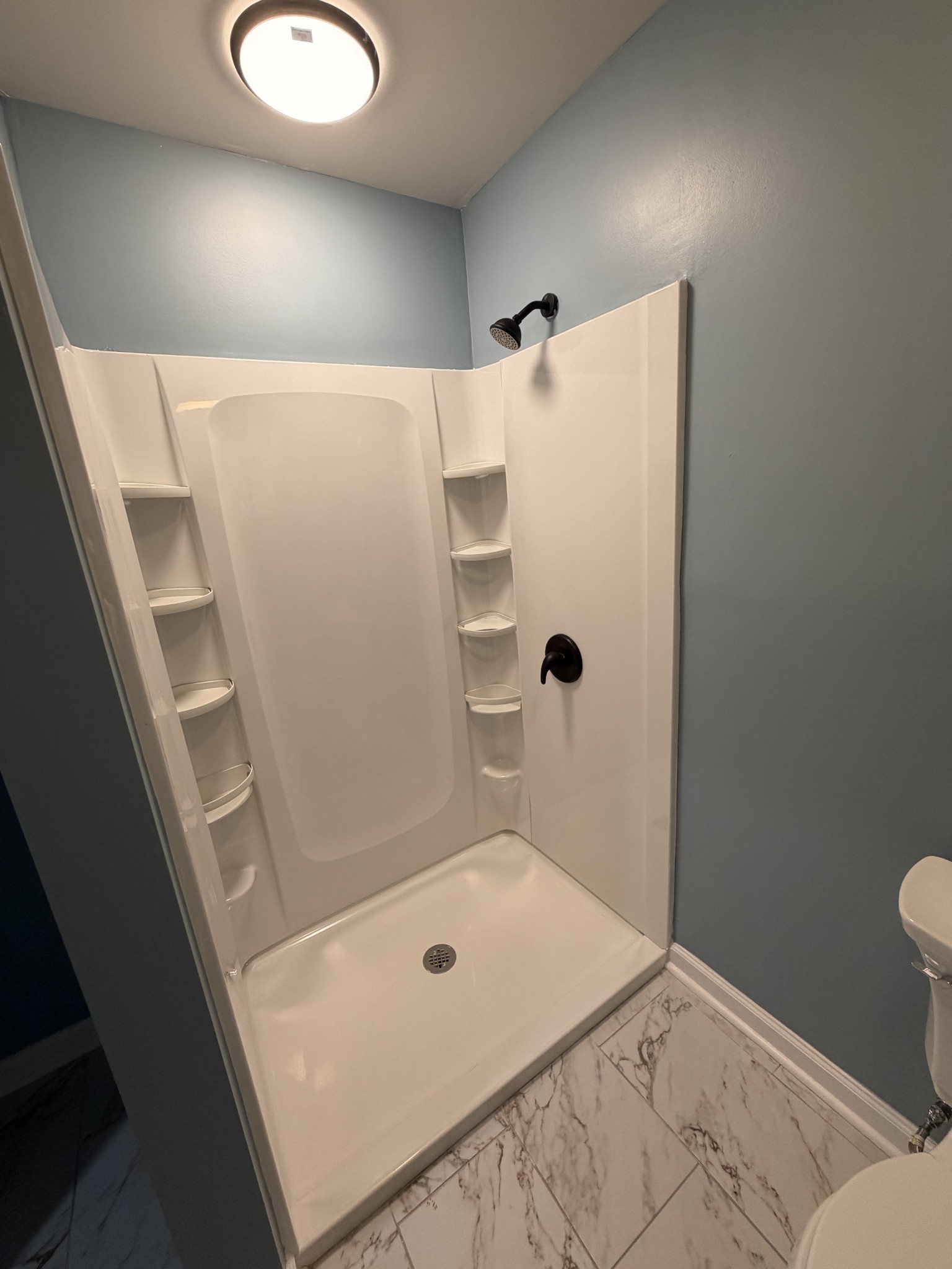 4973 Awalt Road Tullahoma, TN 37388 - Photo 13 of 40 a bathroom with a tub and shower