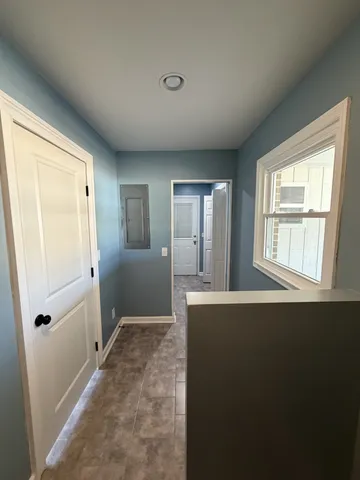 a view of an empty room with a window