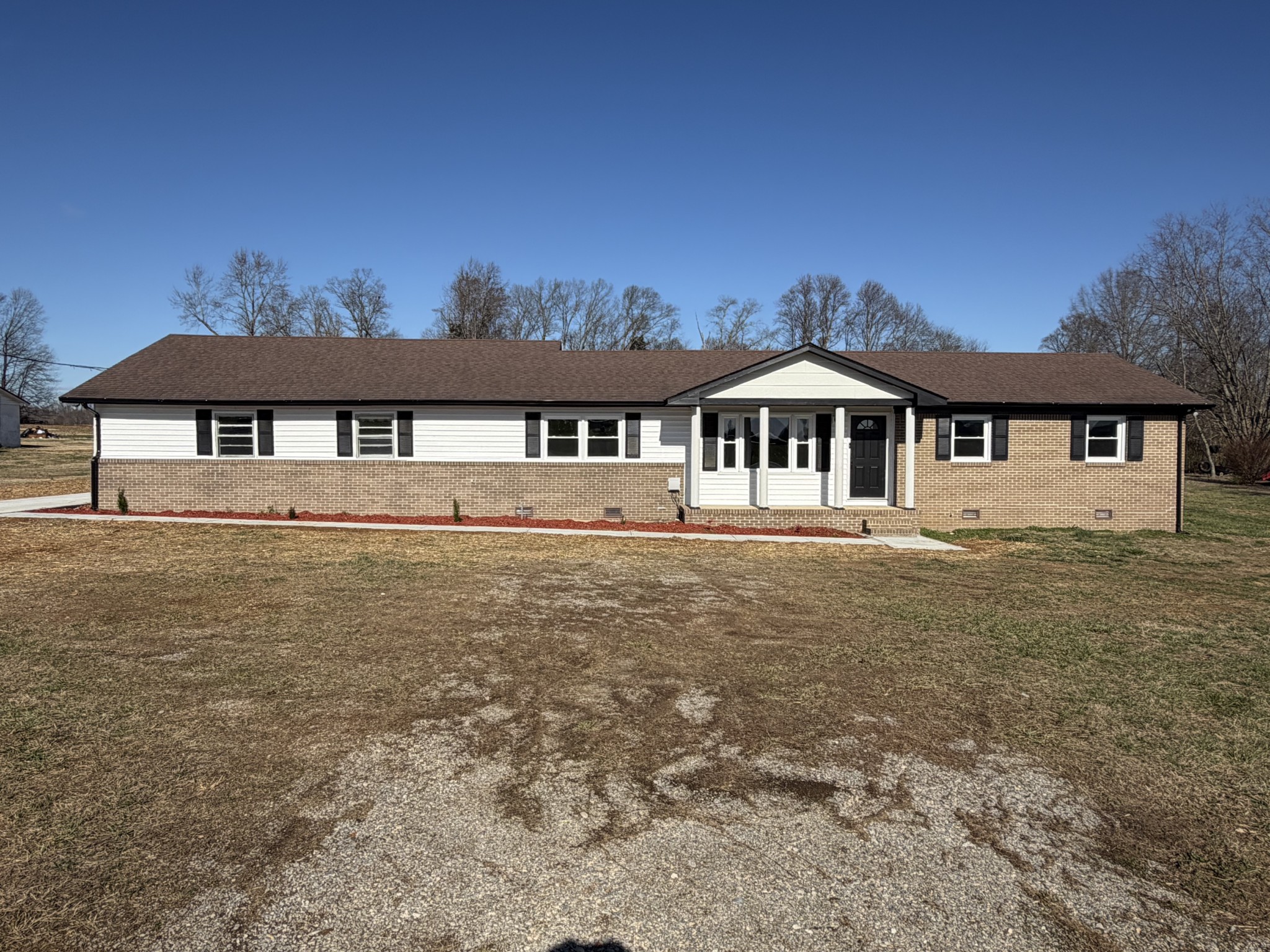4973 Awalt Road Tullahoma, TN 37388 - Photo 2 of 40 a front view of a house with a garden