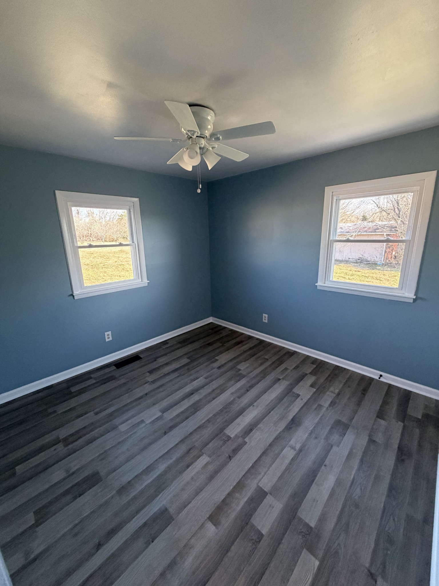 4973 Awalt Road Tullahoma, TN 37388 - Photo 22 of 40 a view of empty room with wooden floor and fan