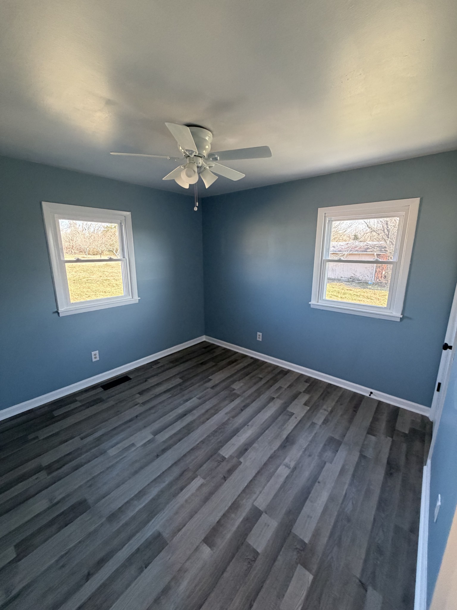 4973 Awalt Road Tullahoma, TN 37388 - Photo 23 of 40 a view of an empty room with a window and wooden floor