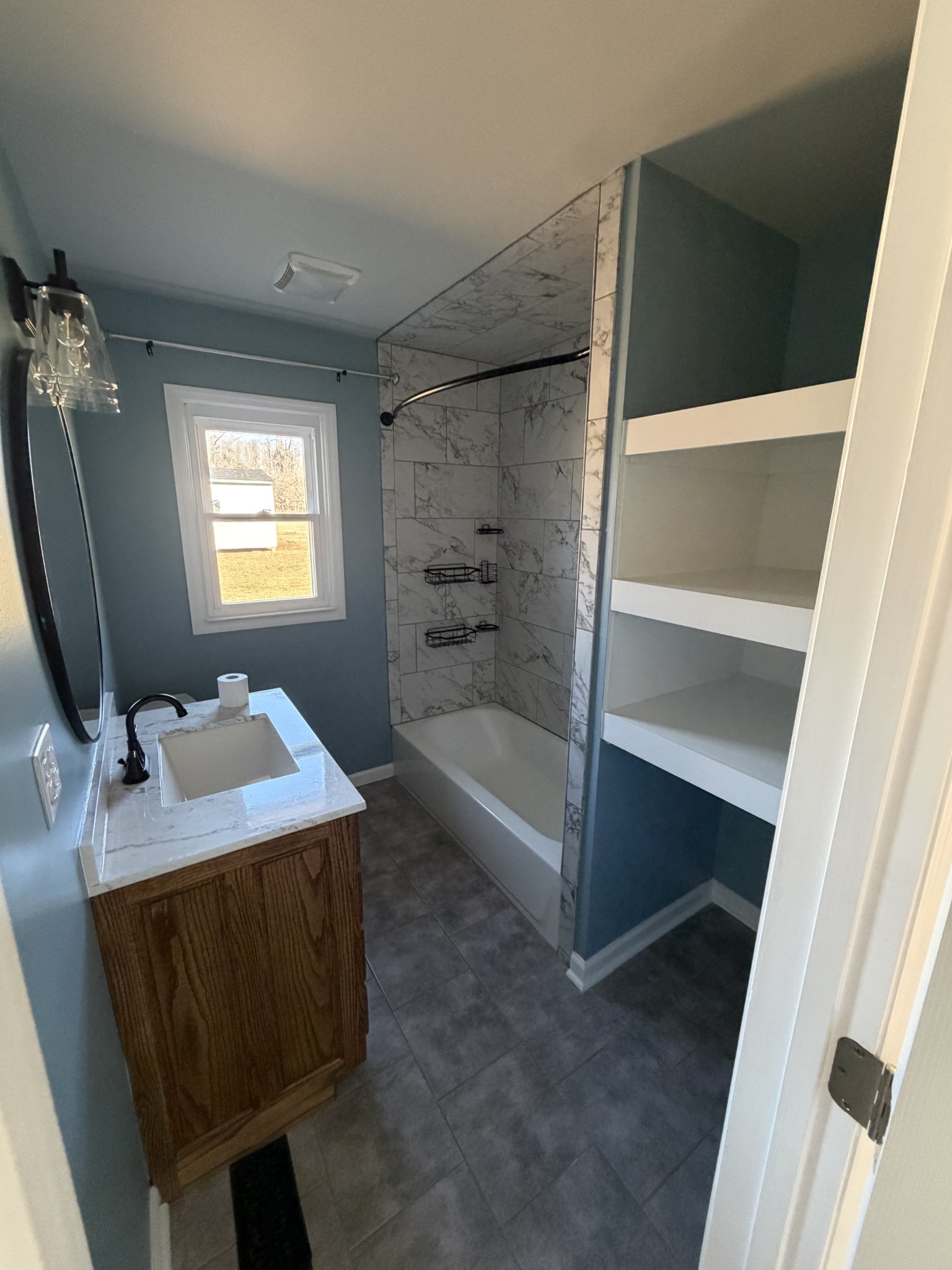 4973 Awalt Road Tullahoma, TN 37388 - Photo 24 of 40 a bathroom with a sink toilet and tub