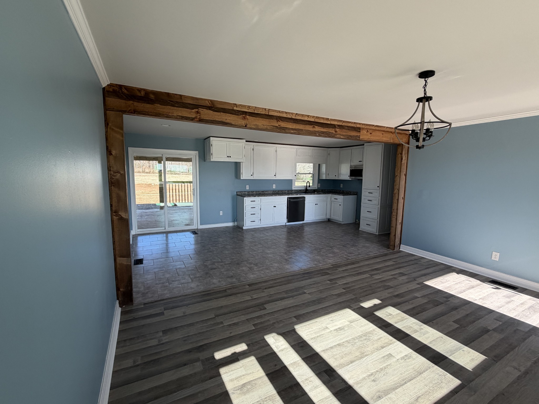 4973 Awalt Road Tullahoma, TN 37388 - Photo 6 of 40 a view of kitchen and hall with wooden floor