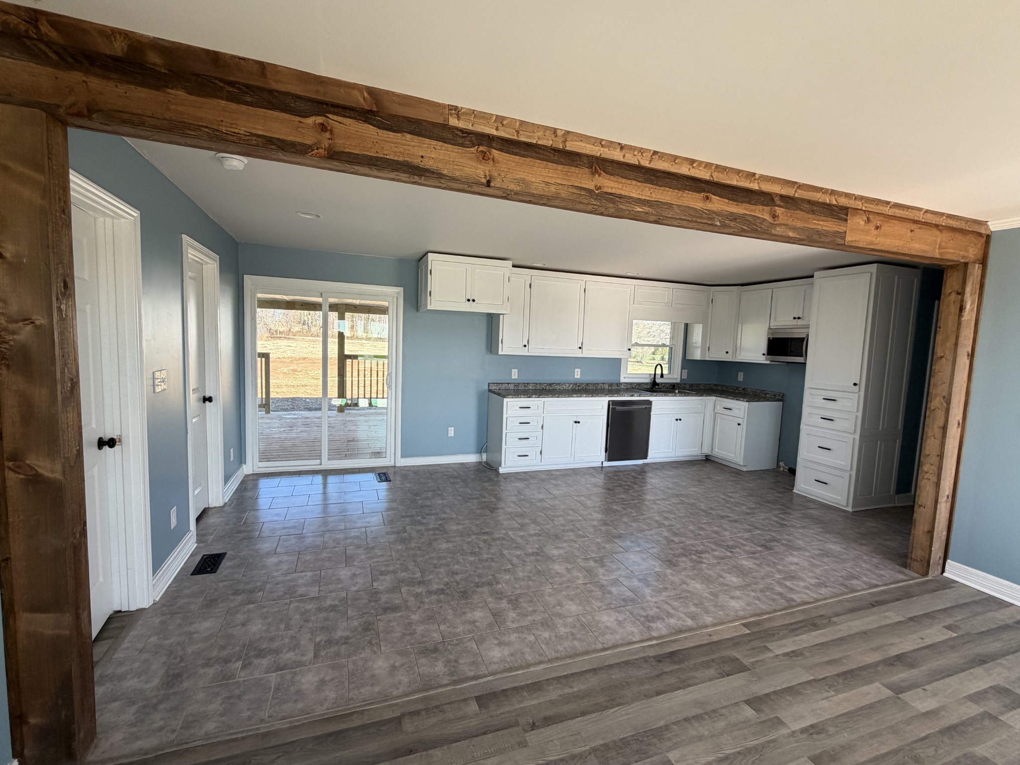 4973 Awalt Road Tullahoma, TN 37388 - Photo 7 of 40 a view of a kitchen with a sink and wooden floor