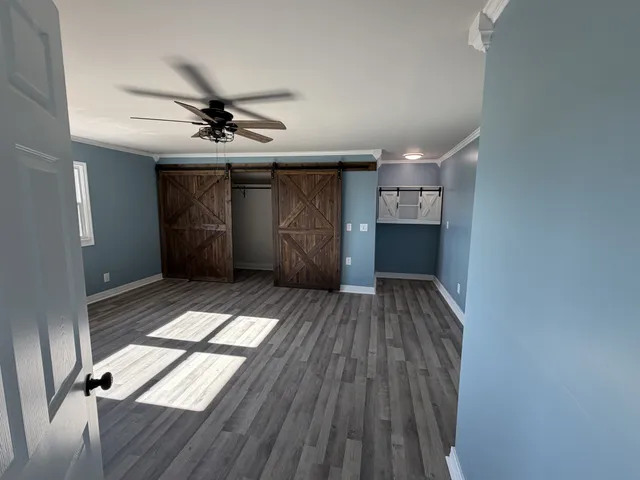 a view of entryway with wooden floor