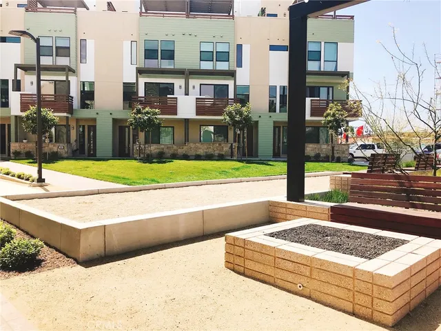 a view of a street with brick building in front of it