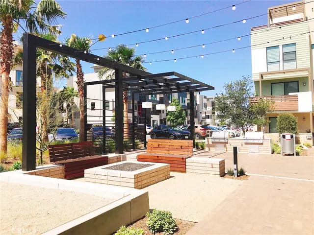 a view of a patio with chairs and tables