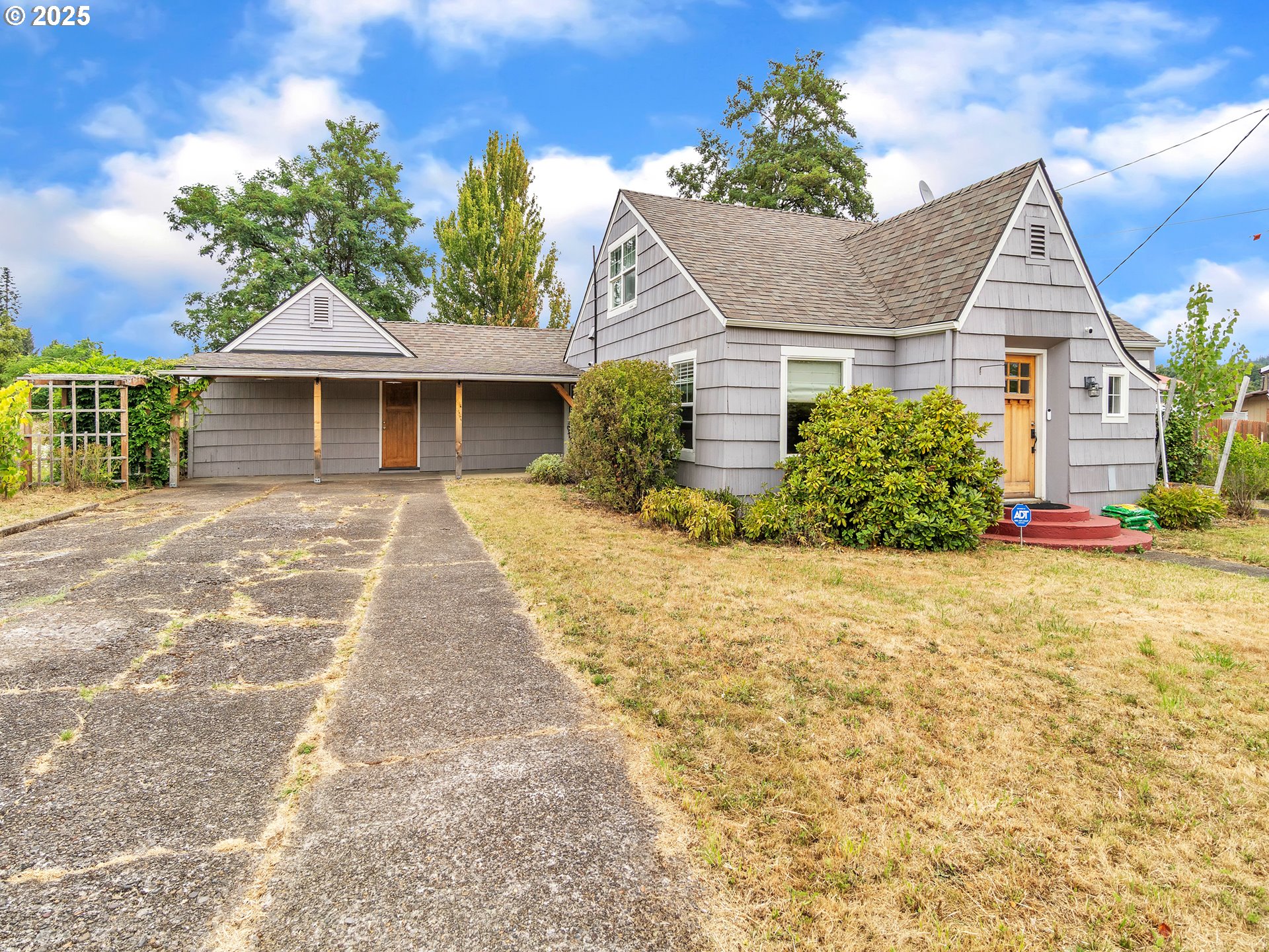 38280 Southwest Fort Hill Road Willamina, OR 97396 - Photo 1 of 31 a front view of a house with a yard and potted plants