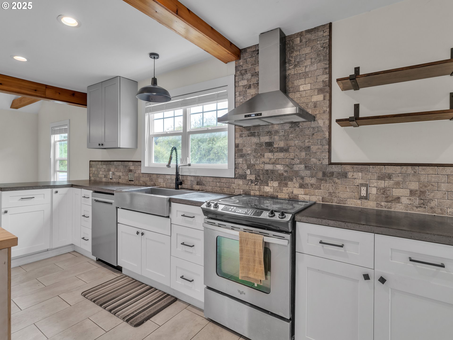 38280 Southwest Fort Hill Road Willamina, OR 97396 - Photo 15 of 31 a kitchen with stainless steel appliances a stove sink and cabinets