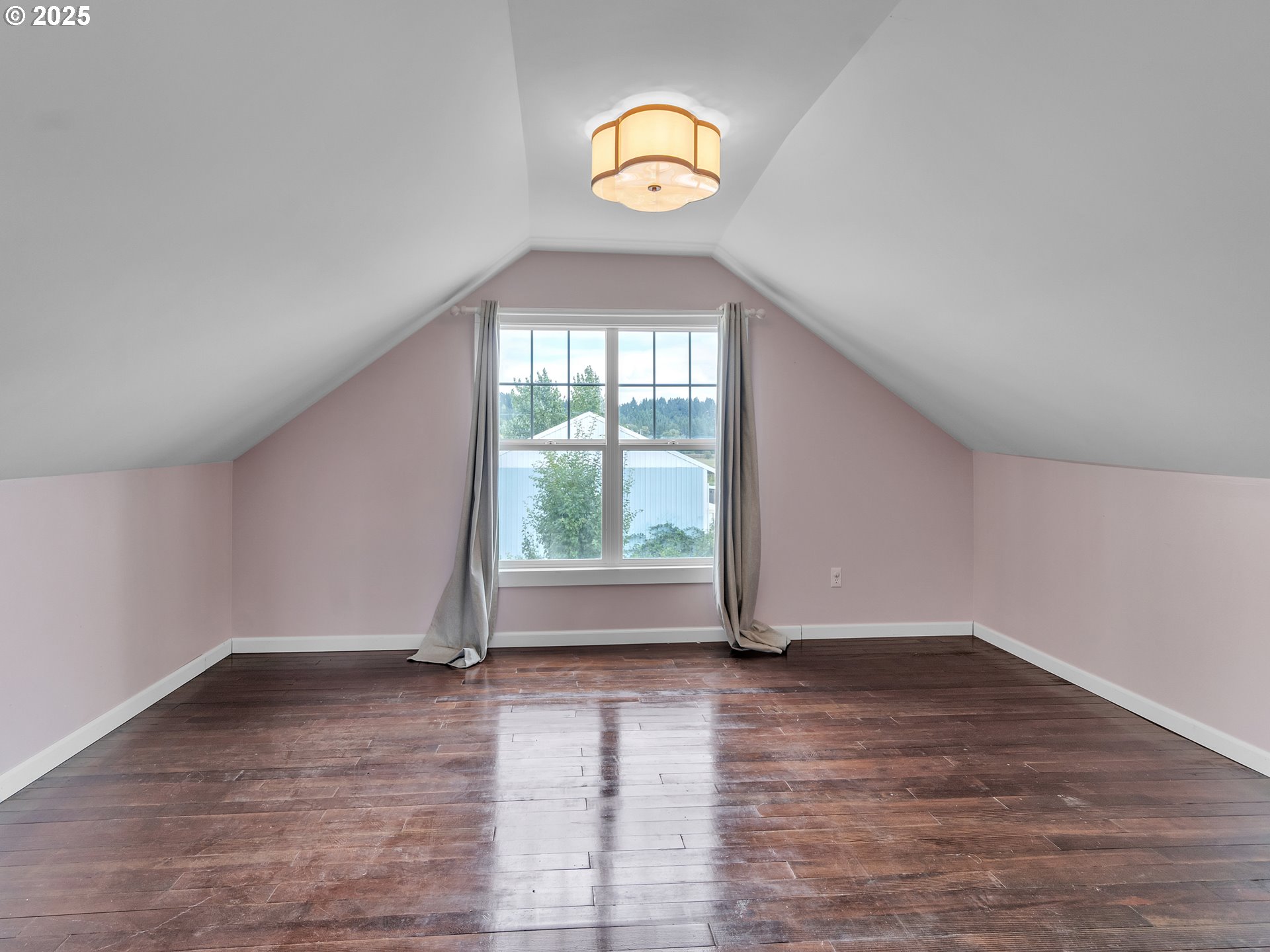 38280 Southwest Fort Hill Road Willamina, OR 97396 - Photo 19 of 31 an empty room with wooden floor and windows