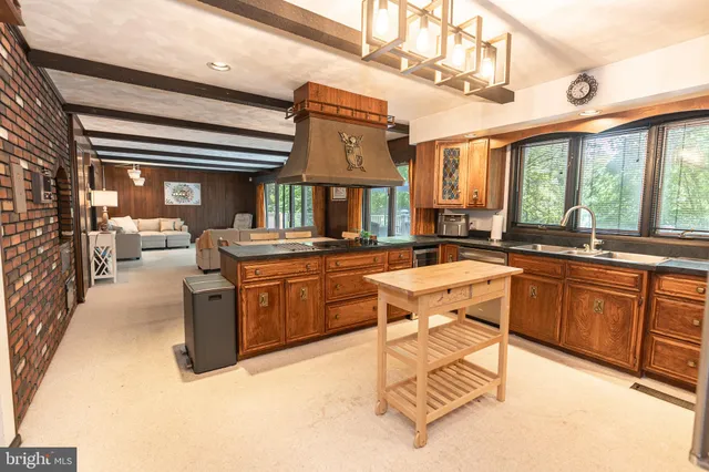 a kitchen with a sink and a refrigerator