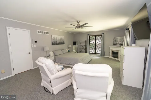 a spacious bathroom with a bathtub and shower