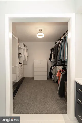 a bathroom with a shower sink and mirror
