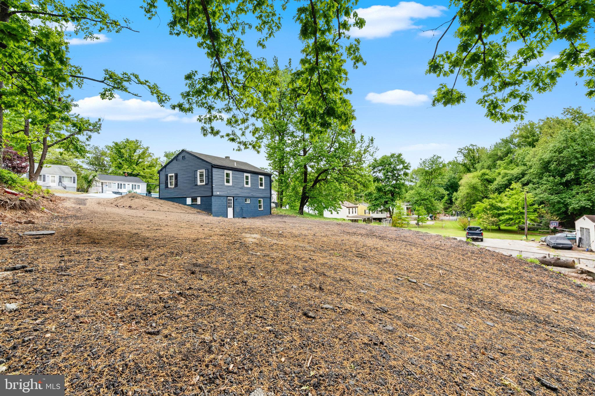 9529 Temple Hill Road Clinton, MD 20735 - Photo 14 of 14 a view of house with a yard and tree in the background