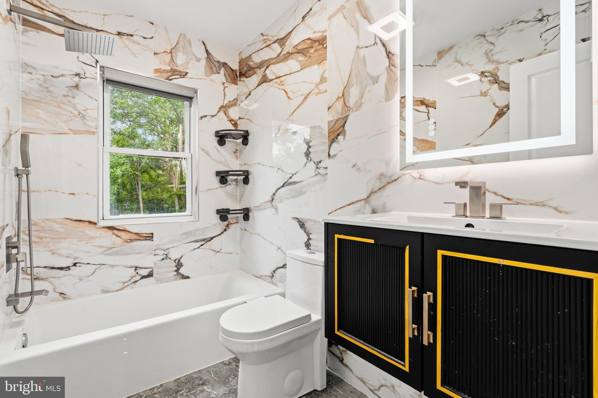 9529 Temple Hill Road Clinton, MD 20735 - Photo 5 of 14 a bathroom with a sink a toilet and bathtub