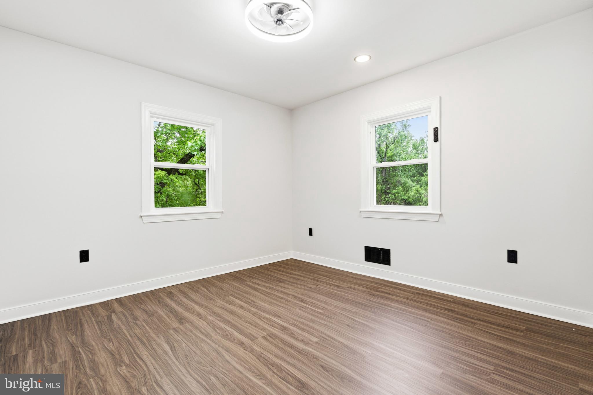 9529 Temple Hill Road Clinton, MD 20735 - Photo 6 of 14 an empty room with wooden floor and windows