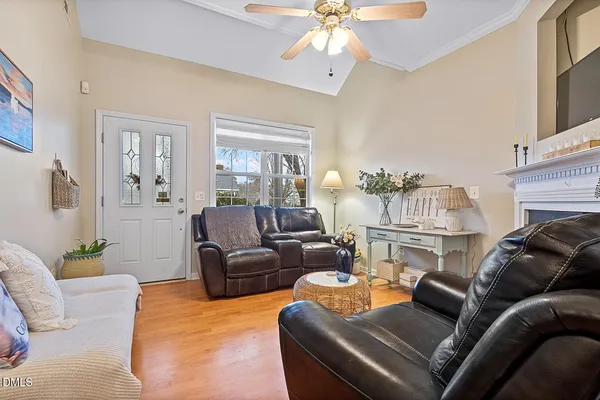 a living room with furniture and a fireplace